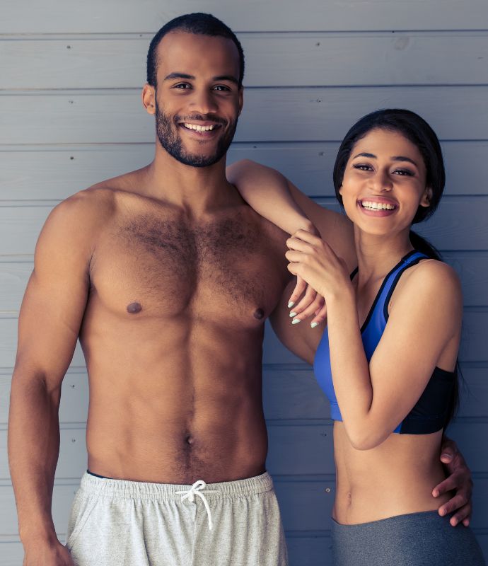 a-cheerful-couple-in-fitness-gear-touch-up-to-each-other
